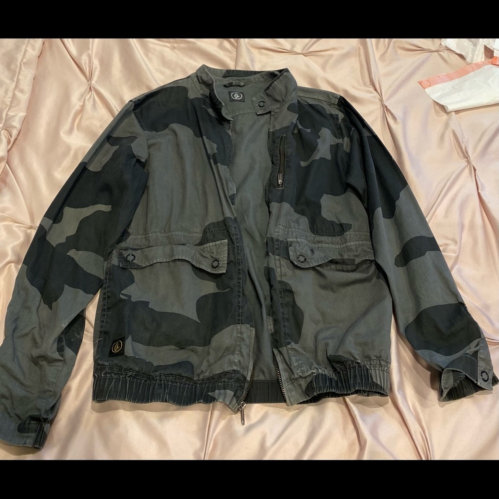 Black long sleeved wind breaker. Design: Camouflage